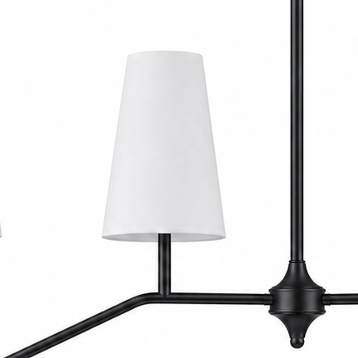 Black finish detail near white fabric shade and branch arm