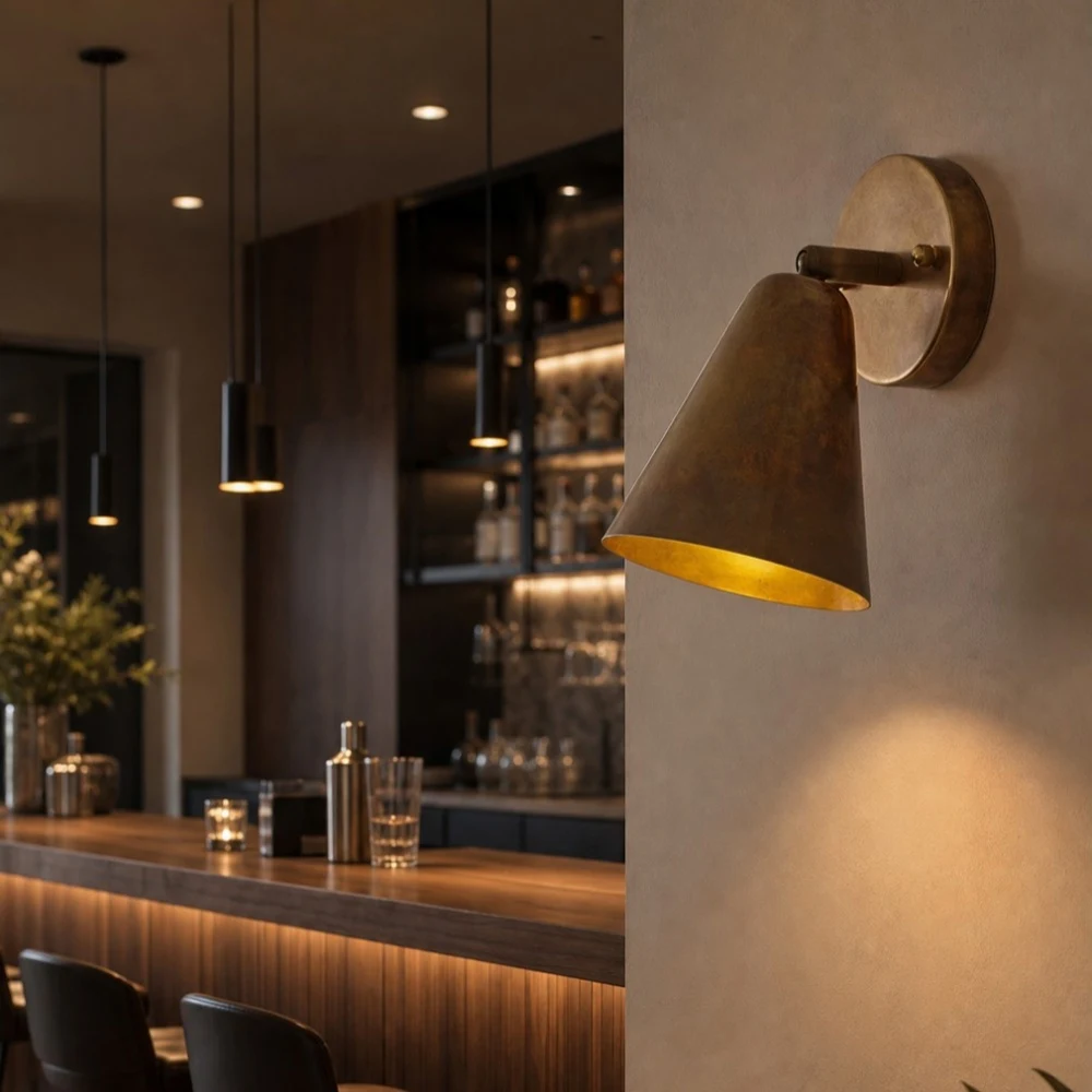 Brass cone wall lamp in a bar interior