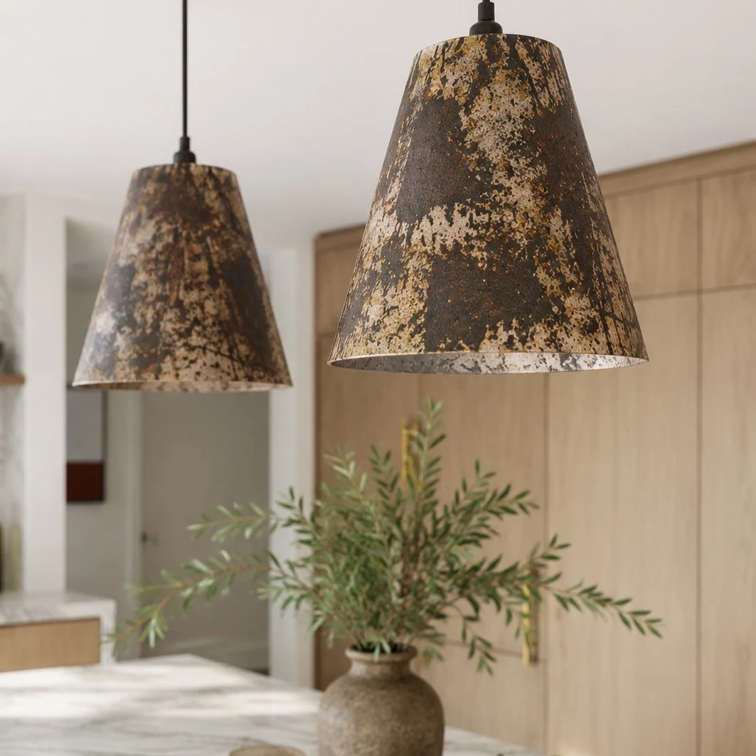 Close view of aged patina metal pendant lamps in a kitchen
