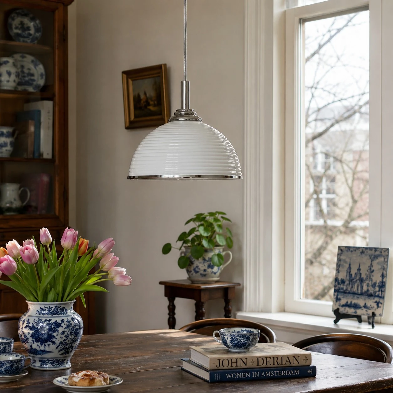 White ribbed pendant light in a bright dining room