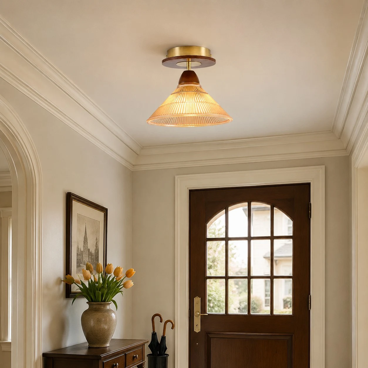 Amber flush mount ceiling light near an arched doorway