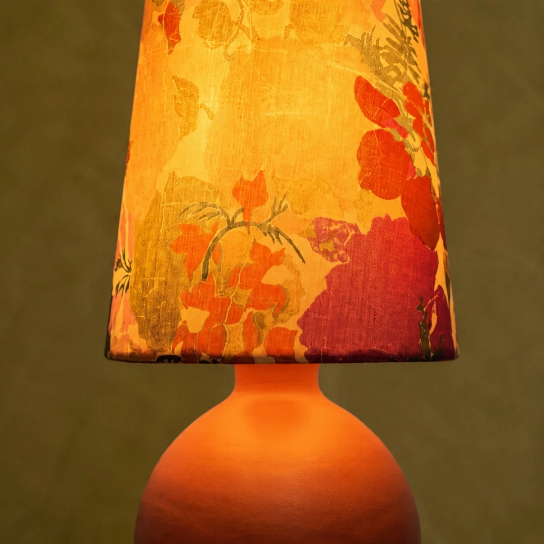 orange round base table lamp