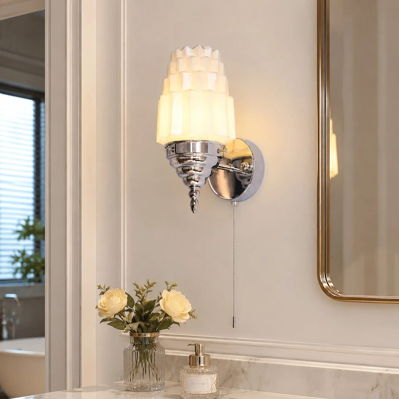 Chrome Art Deco wall light installed beside a mirror
