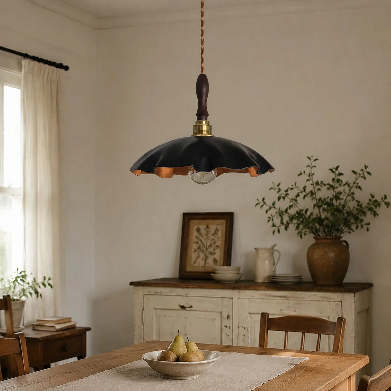 black cowhide pendant light casting warm light over a rustic table