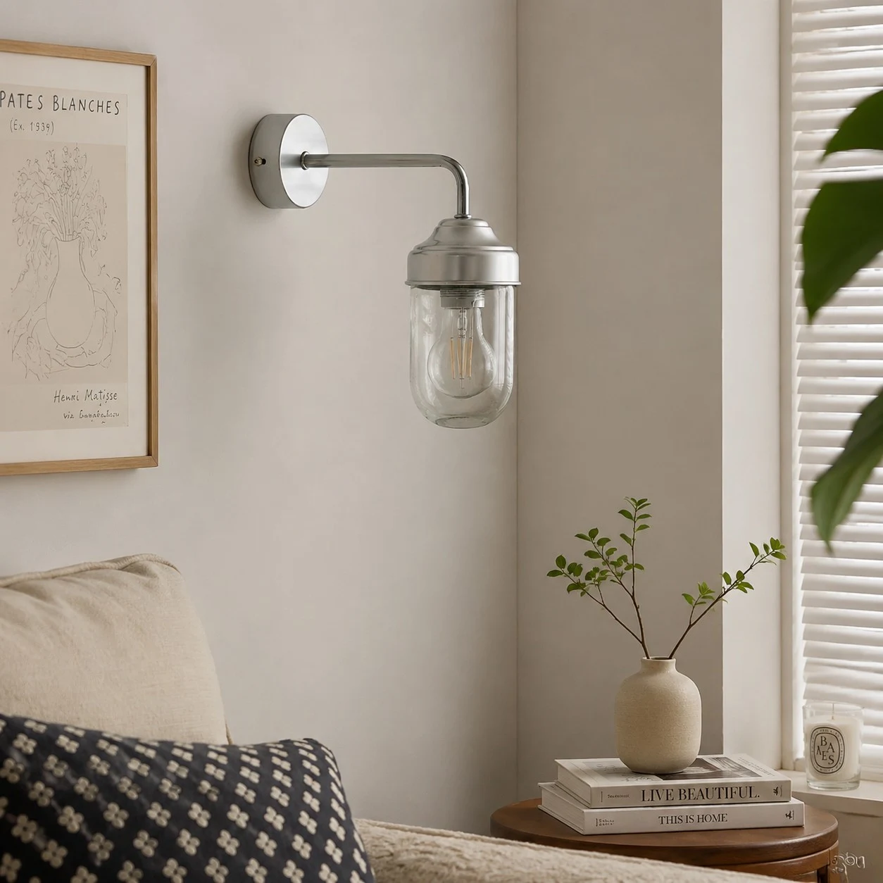 Aluminum glass wall sconce in a calm interior corner