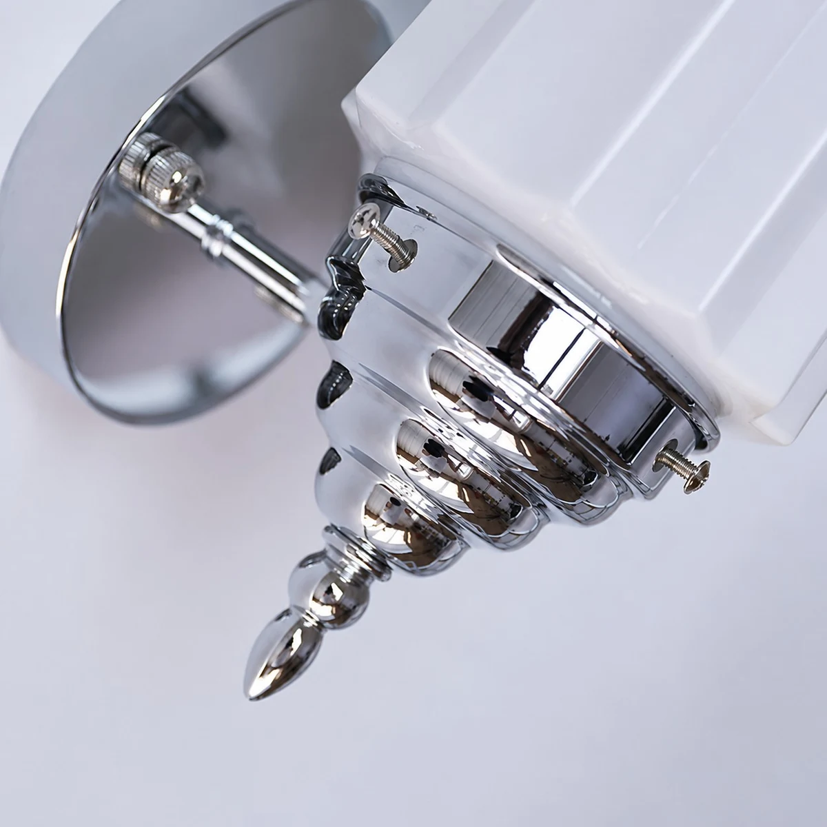 Chrome wall plate and decorative finial detail