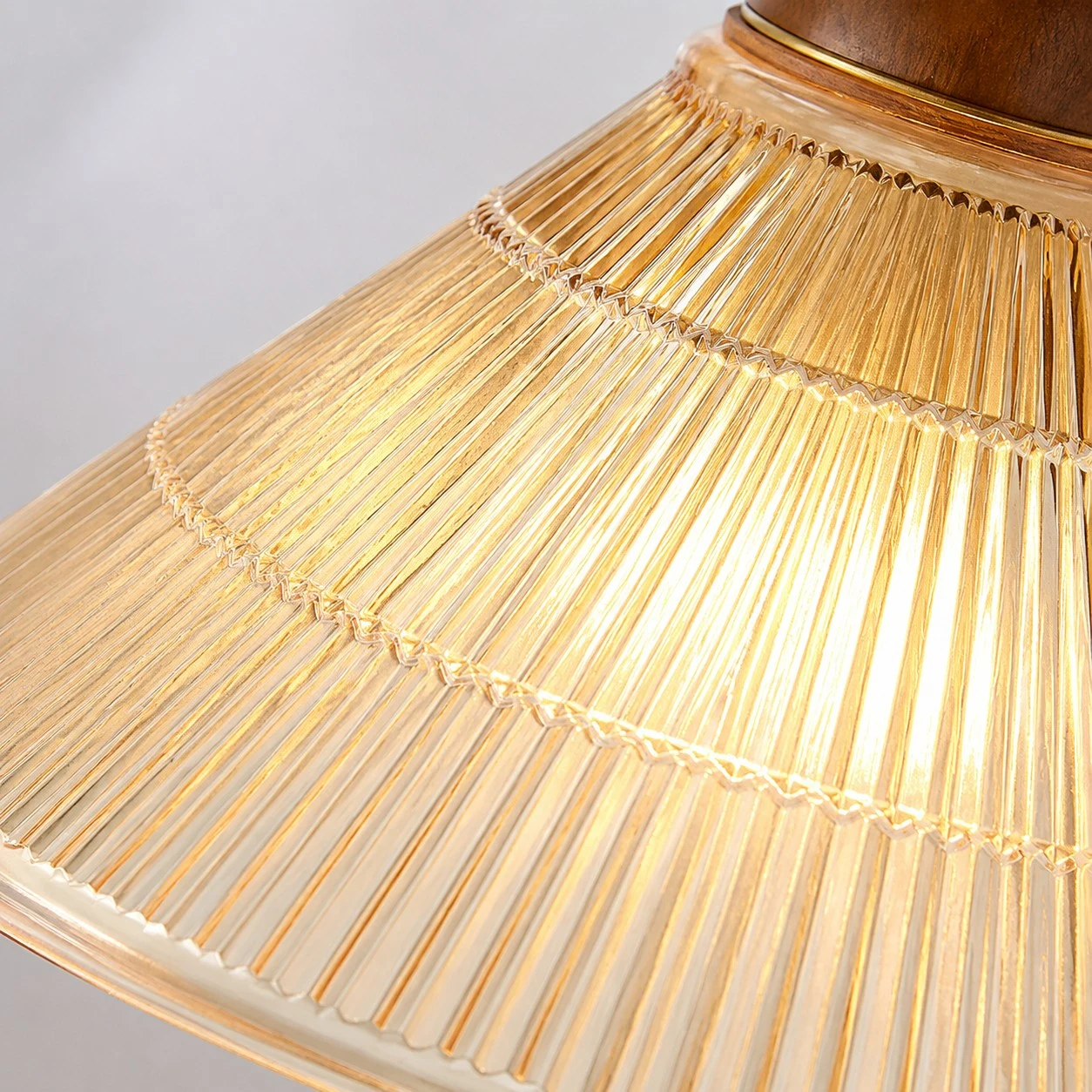 Lit amber pleated shade texture detail