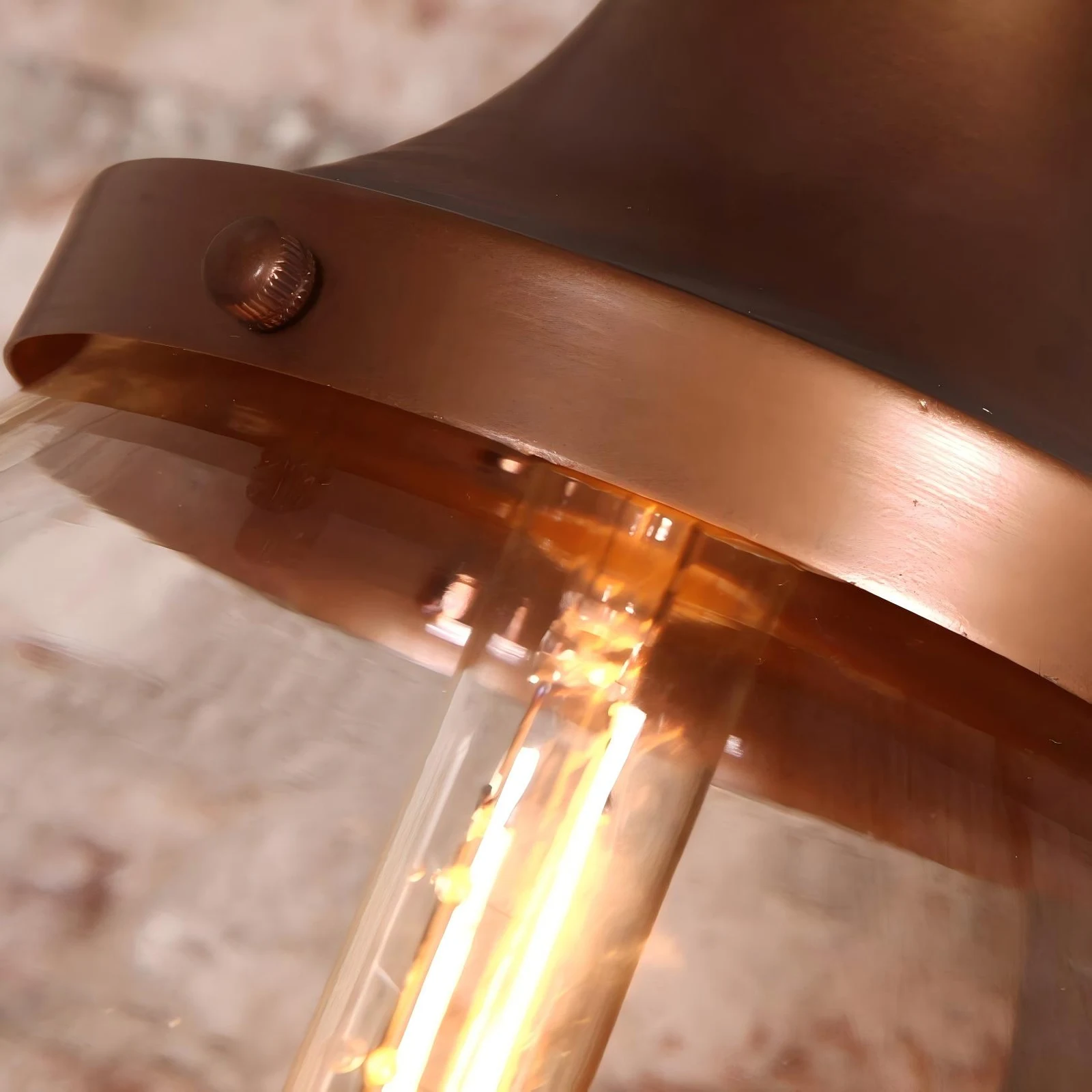 Close view of copper-finish iron cap and illuminated bulb holder
