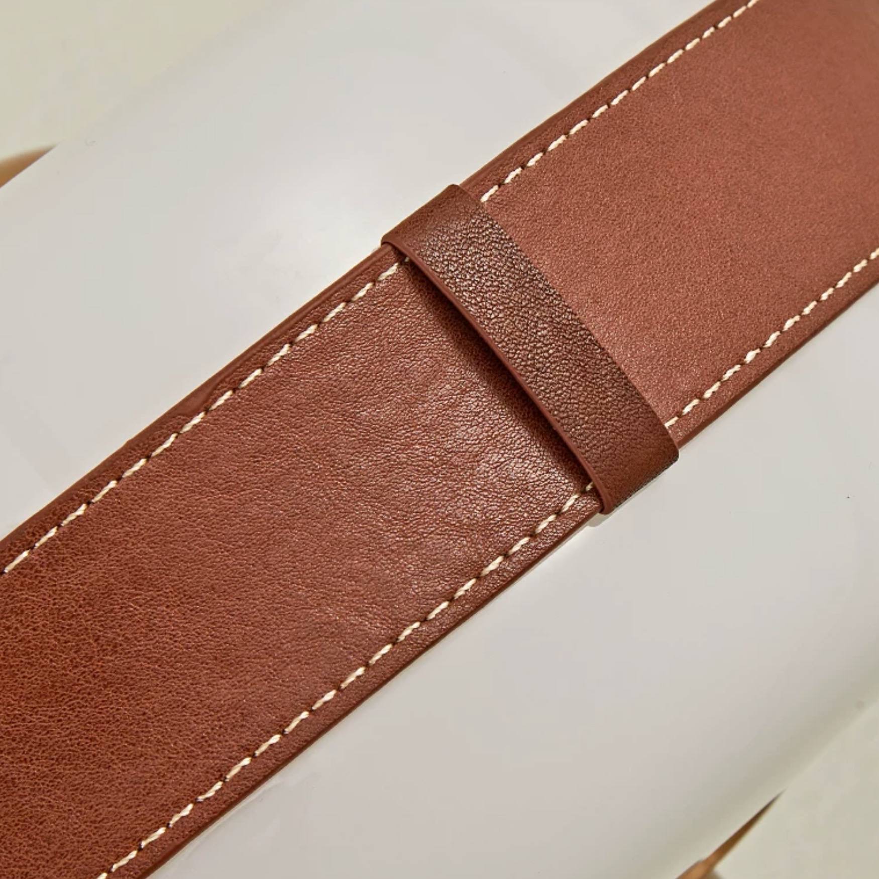 Stitched leather-look band close-up
