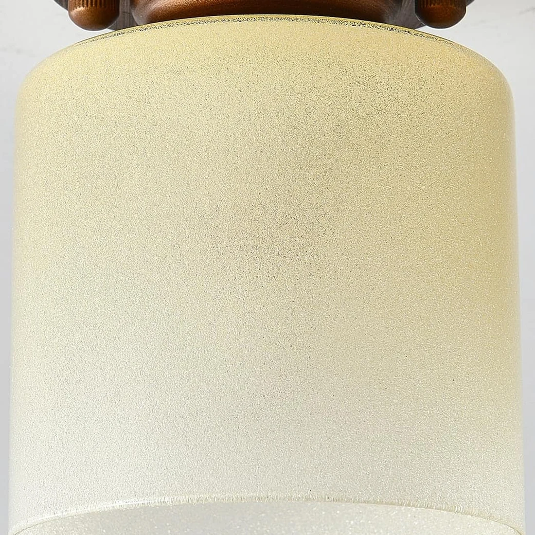 Close detail of gradient yellow glass shade texture