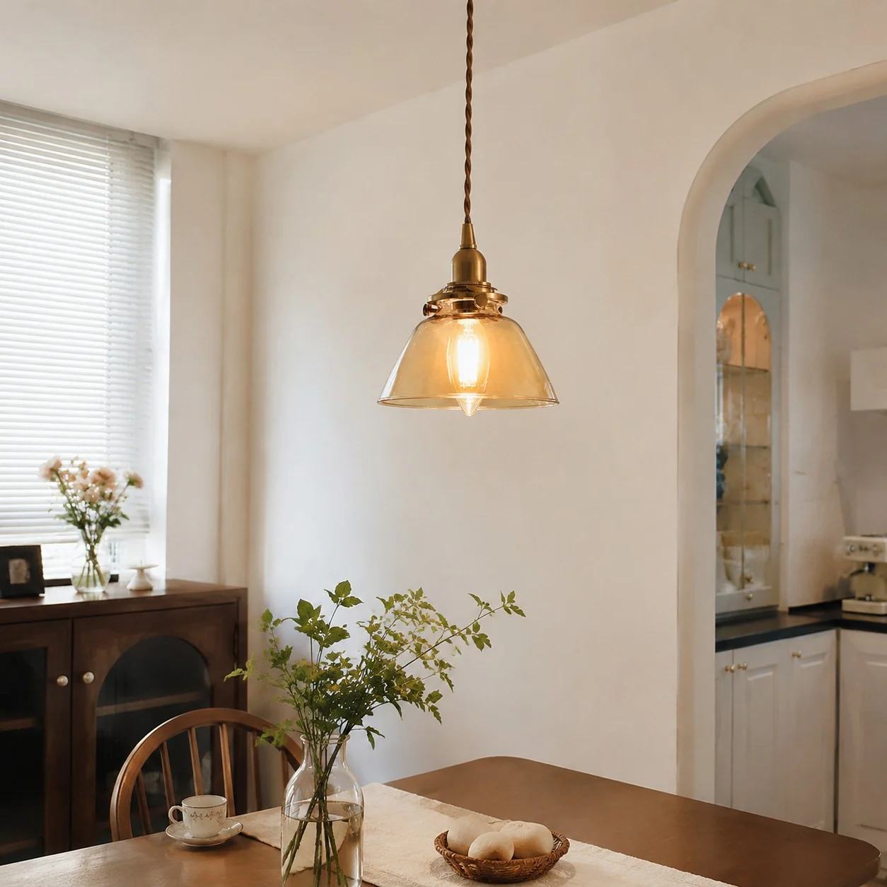 Amber glass pendant in a soft entry scene