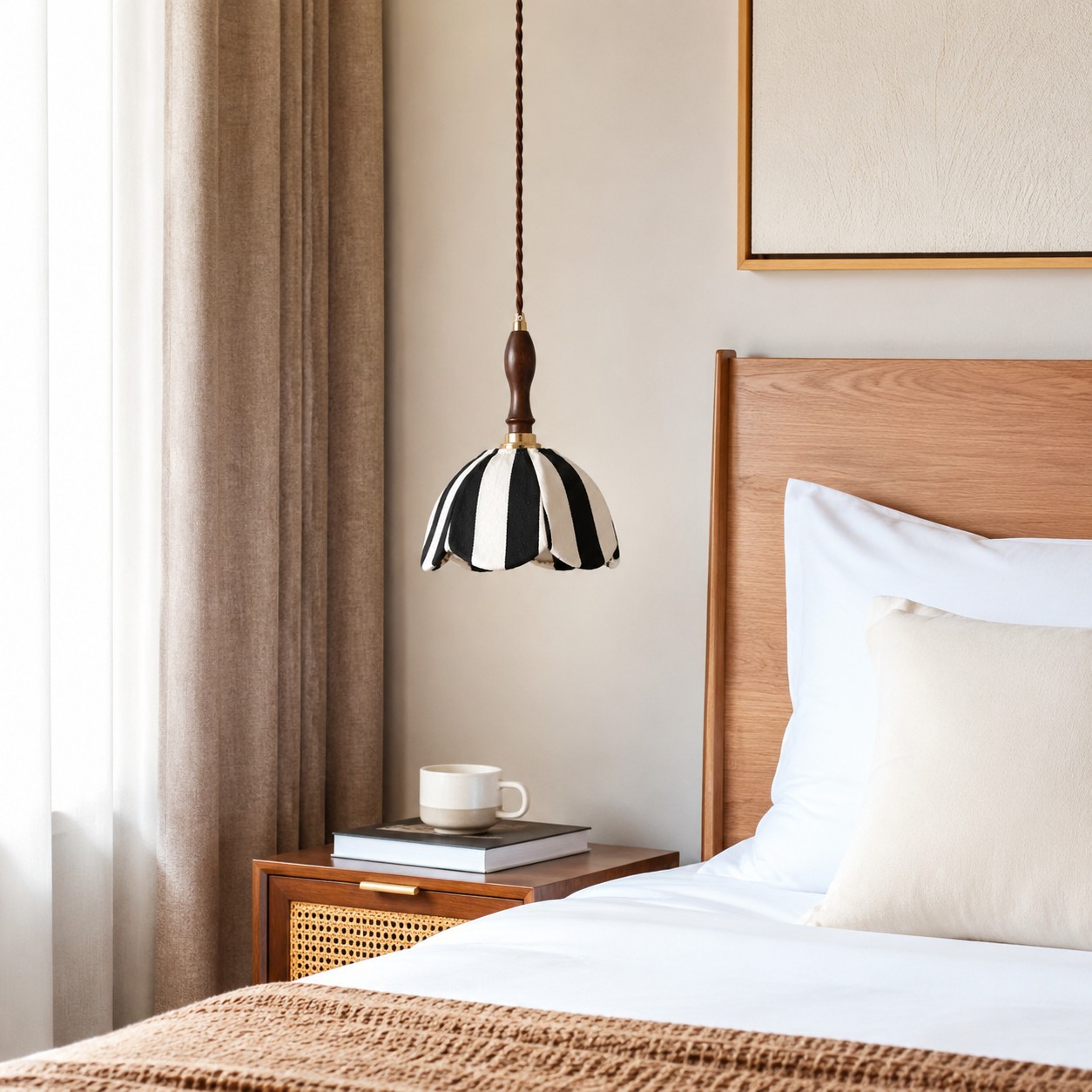 Striped fabric pendant lamp installed beside a warm wood bedroom nightstand