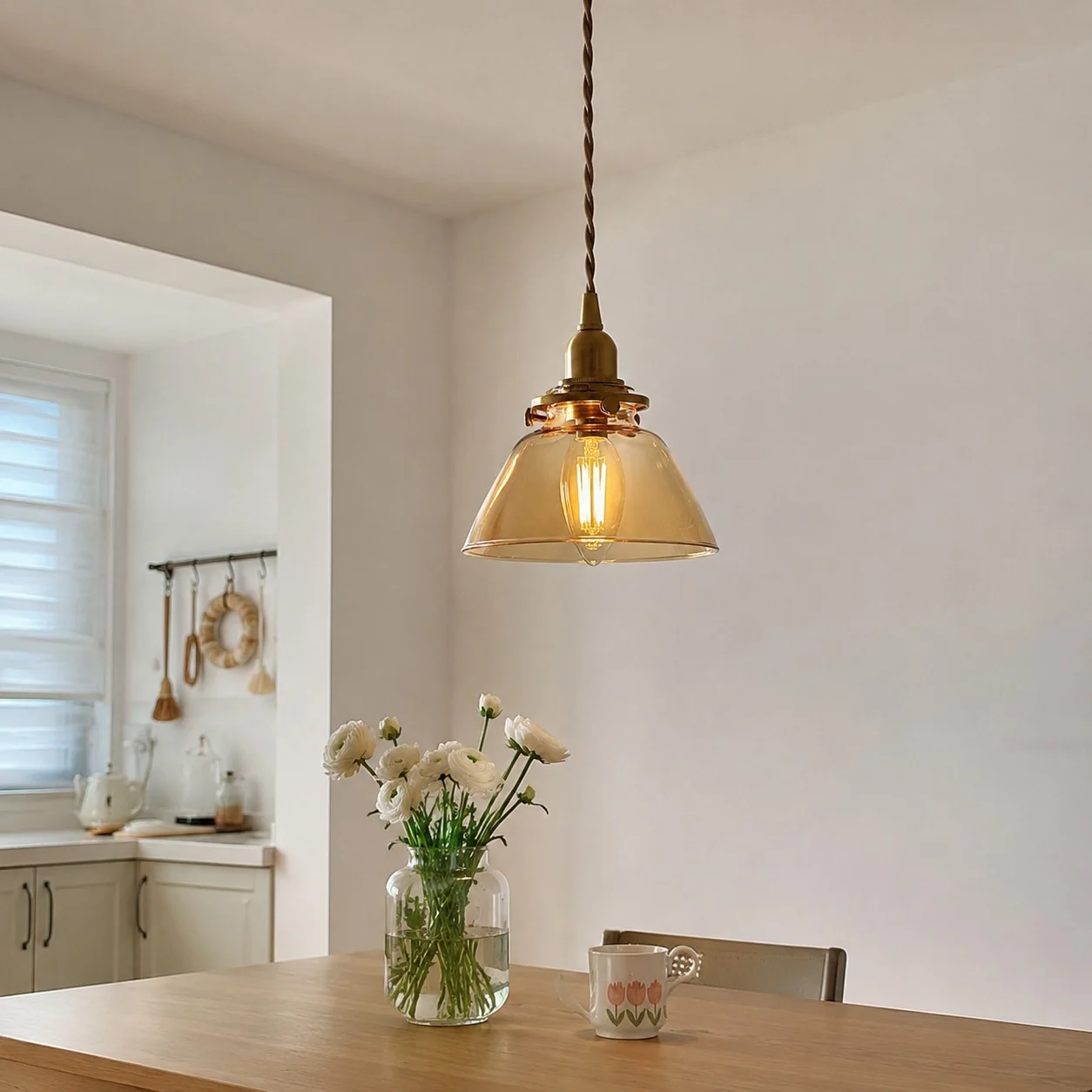 Amber glass pendant above a small table