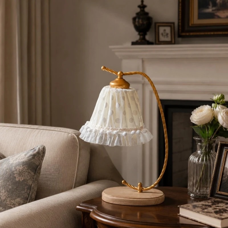 Vintage table lamp styled beside a sofa in a warm living room