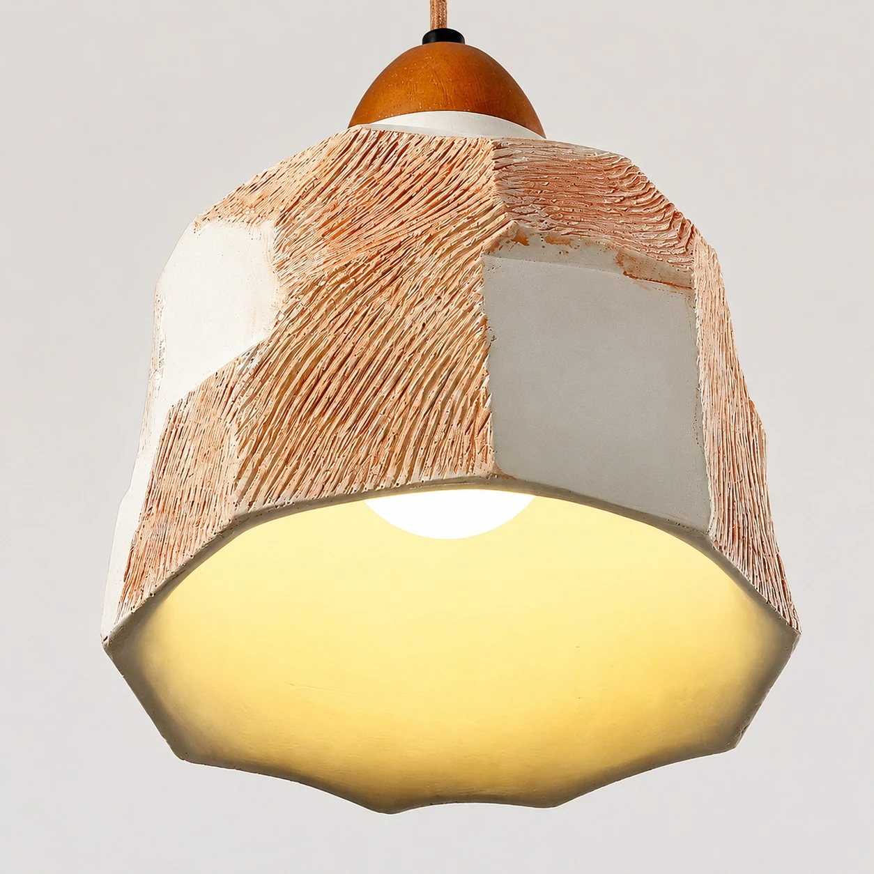 Warm lower glow and faceted shade edge