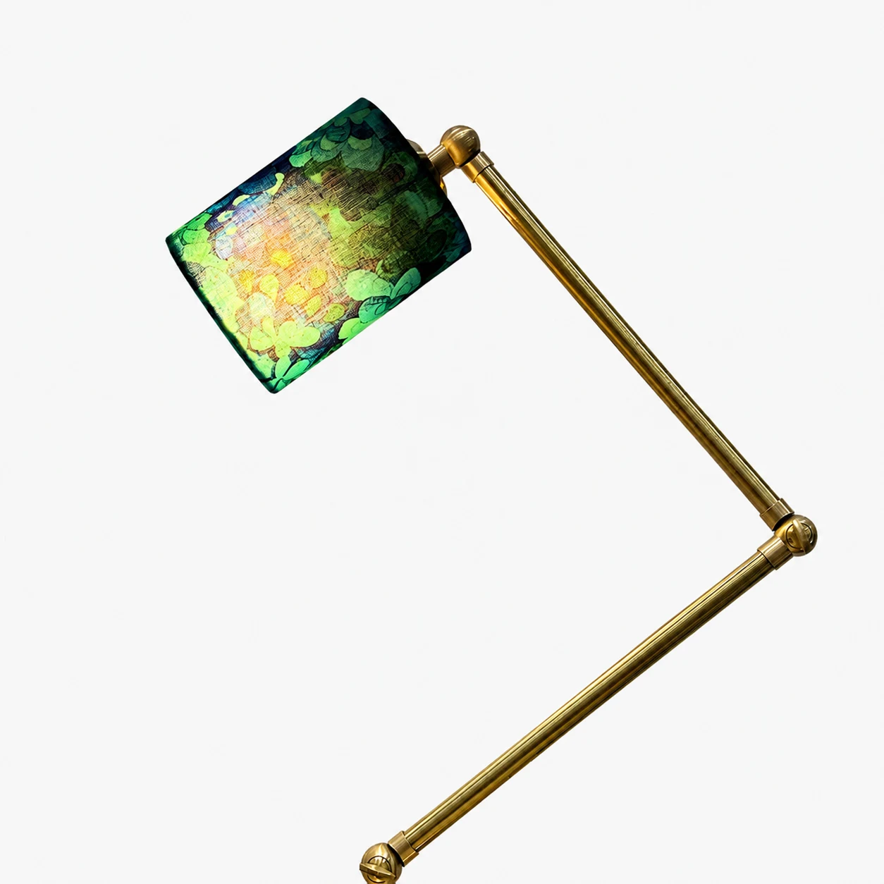 Blue green floral fabric shade glowing warmly when lit