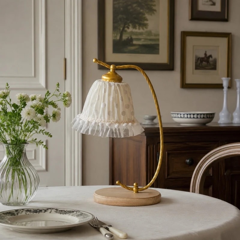 Lamp styled on a dining table with flowers and classic furniture