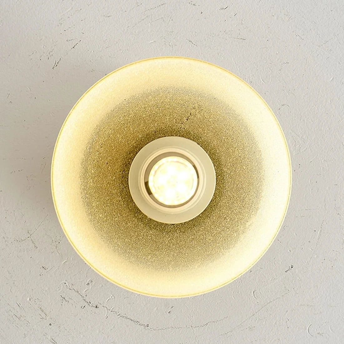 Warm glow detail inside the yellow glass shade
