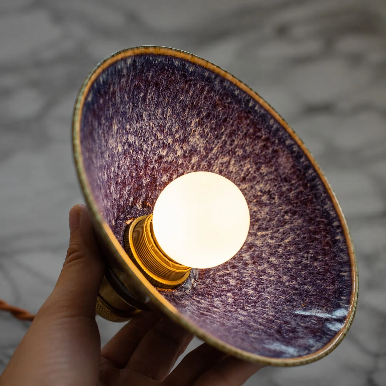 Handheld view of the purple blue ceramic glaze interior