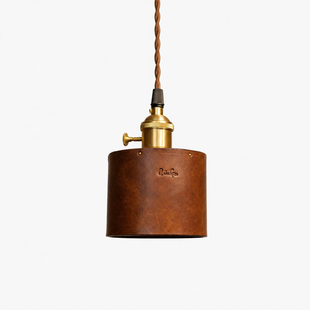 Brown leather cylinder pendant lamp front view