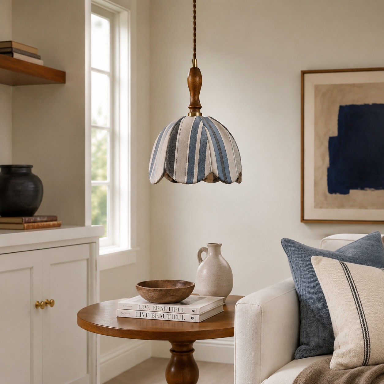 Blue and ivory striped fabric pendant lamp installed in a warm bedroom corner