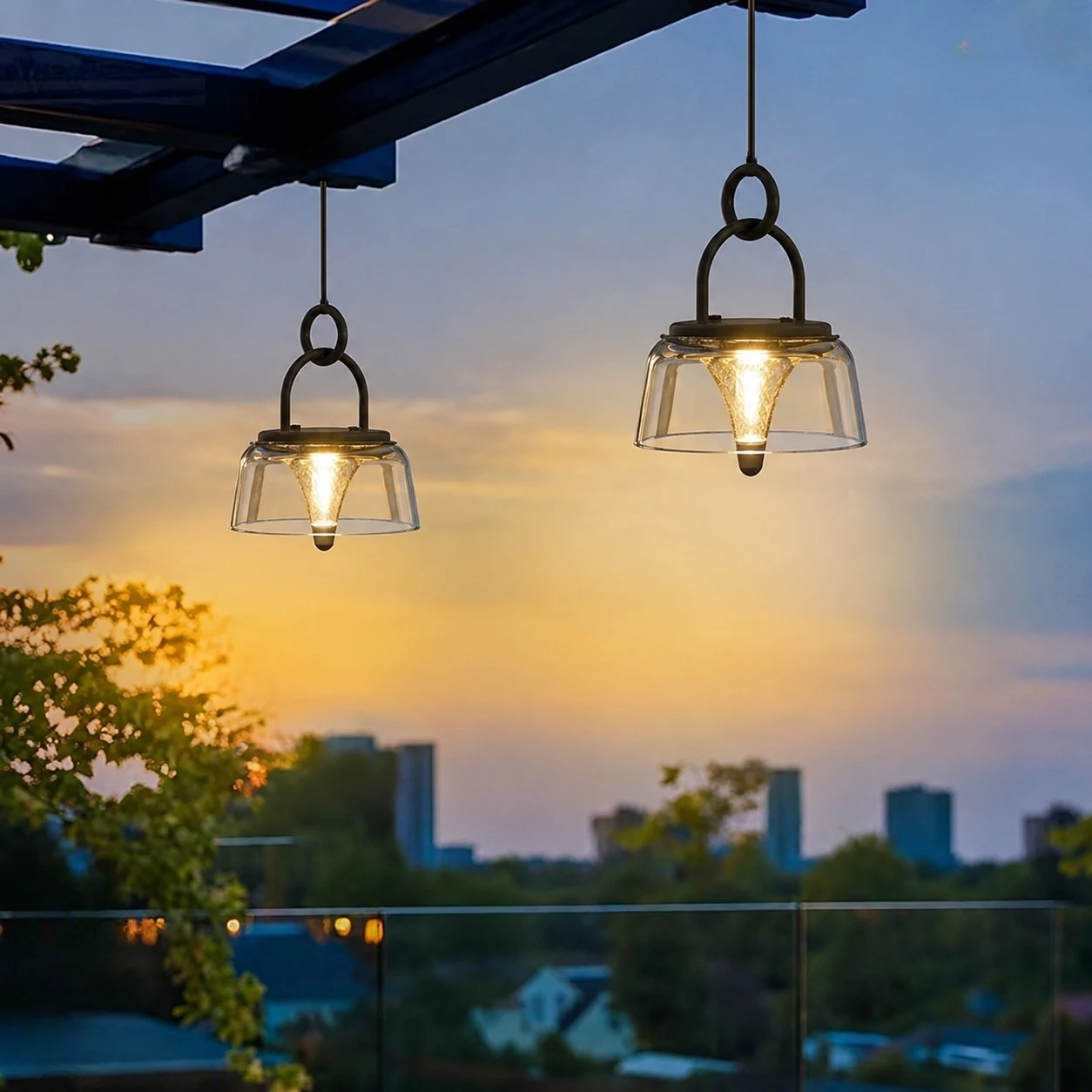 Pair of solar lanterns hanging on a balcony at dusk