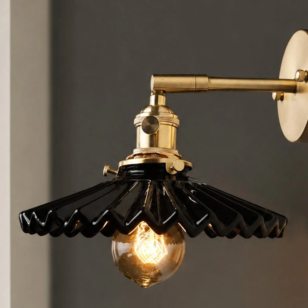 Close view of black pleated ceramic wall sconce shape
