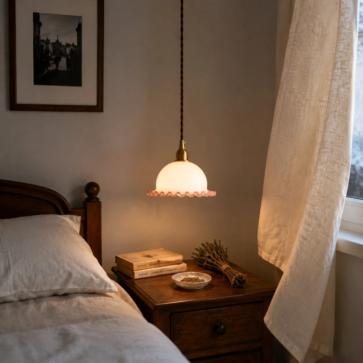 small ruffled glass pendant light installed beside a bed
