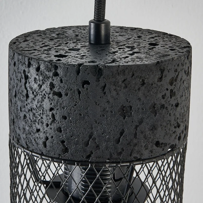 Close view of the black stone texture top and metal suspension connector