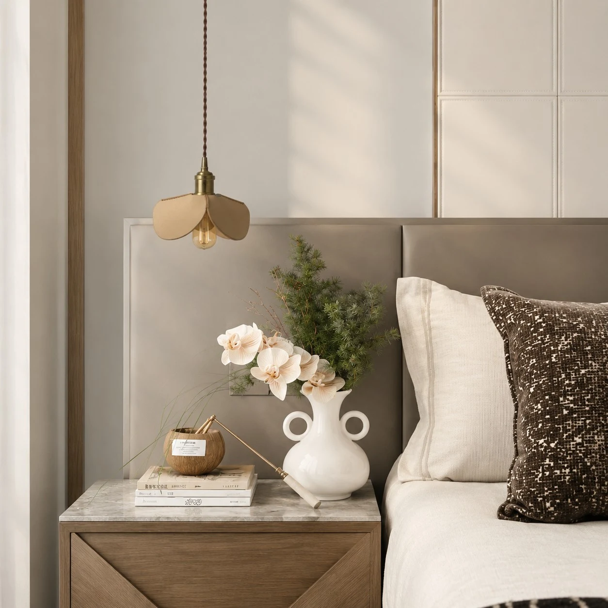 Leather petal pendant light above a bedroom nightstand