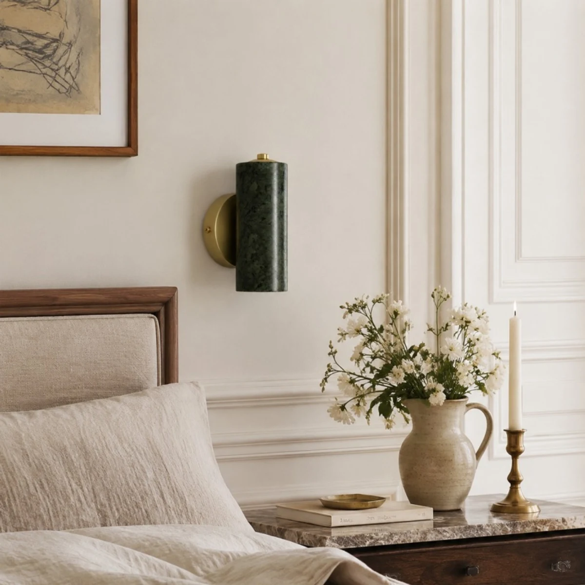 Green jade wall lamp styled above a bedside table