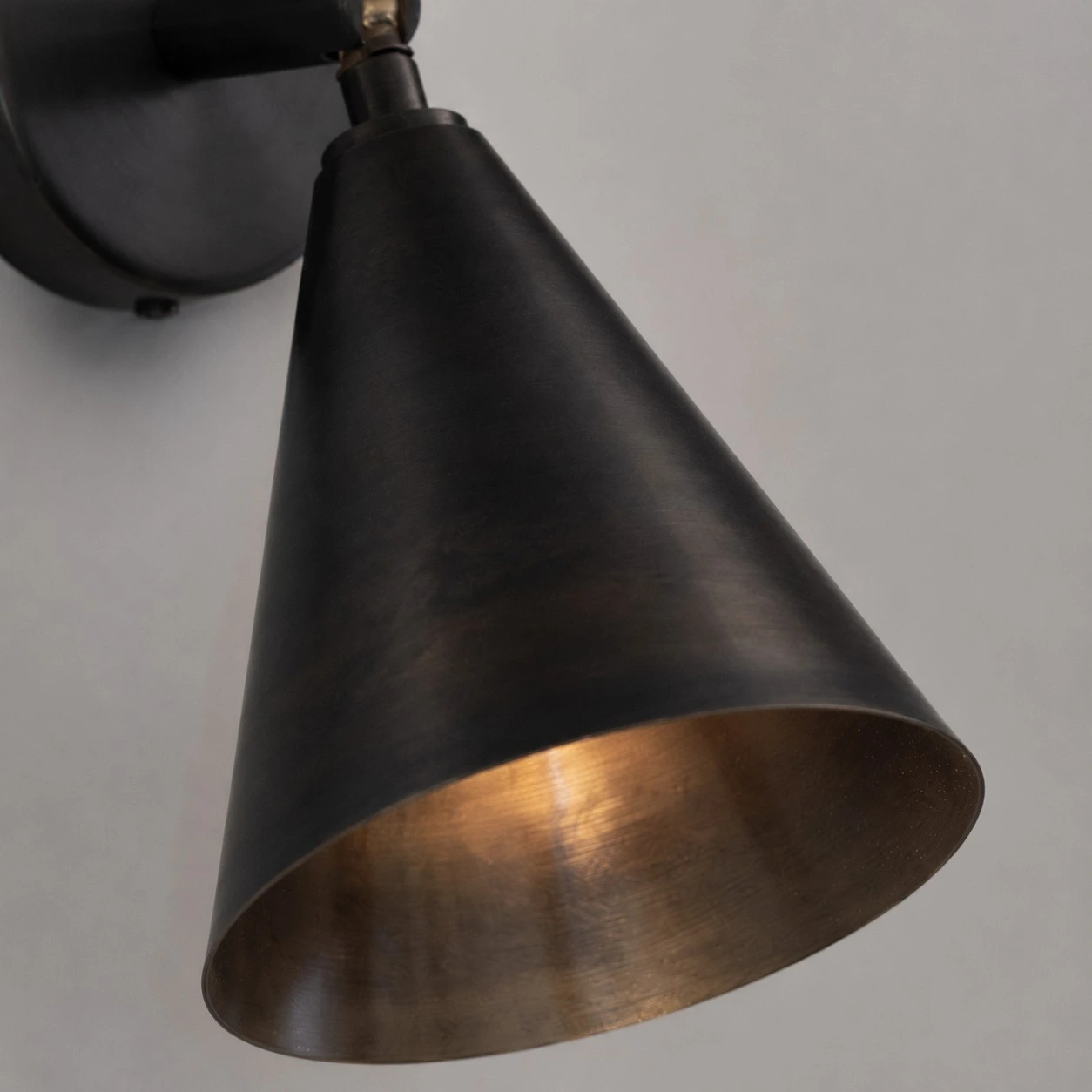 Cone shade and warm inner brass finish close-up