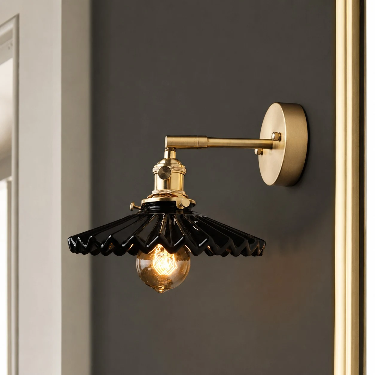Close wall scene of black pleated ceramic wall sconce
