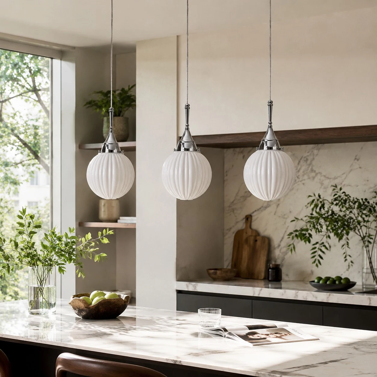 Three ribbed glass pendants above a kitchen island