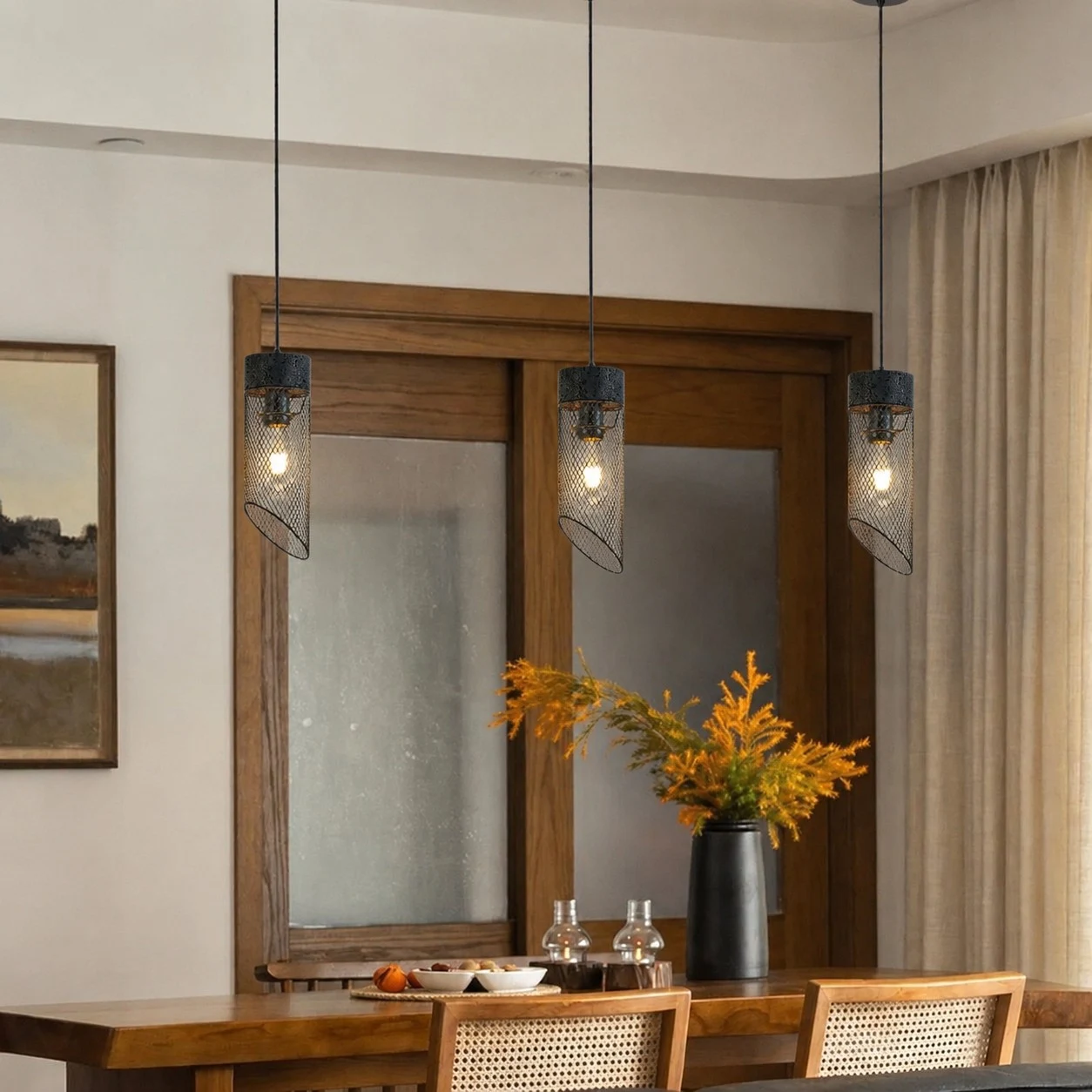 Three black mesh stone pendant lights above a dining counter