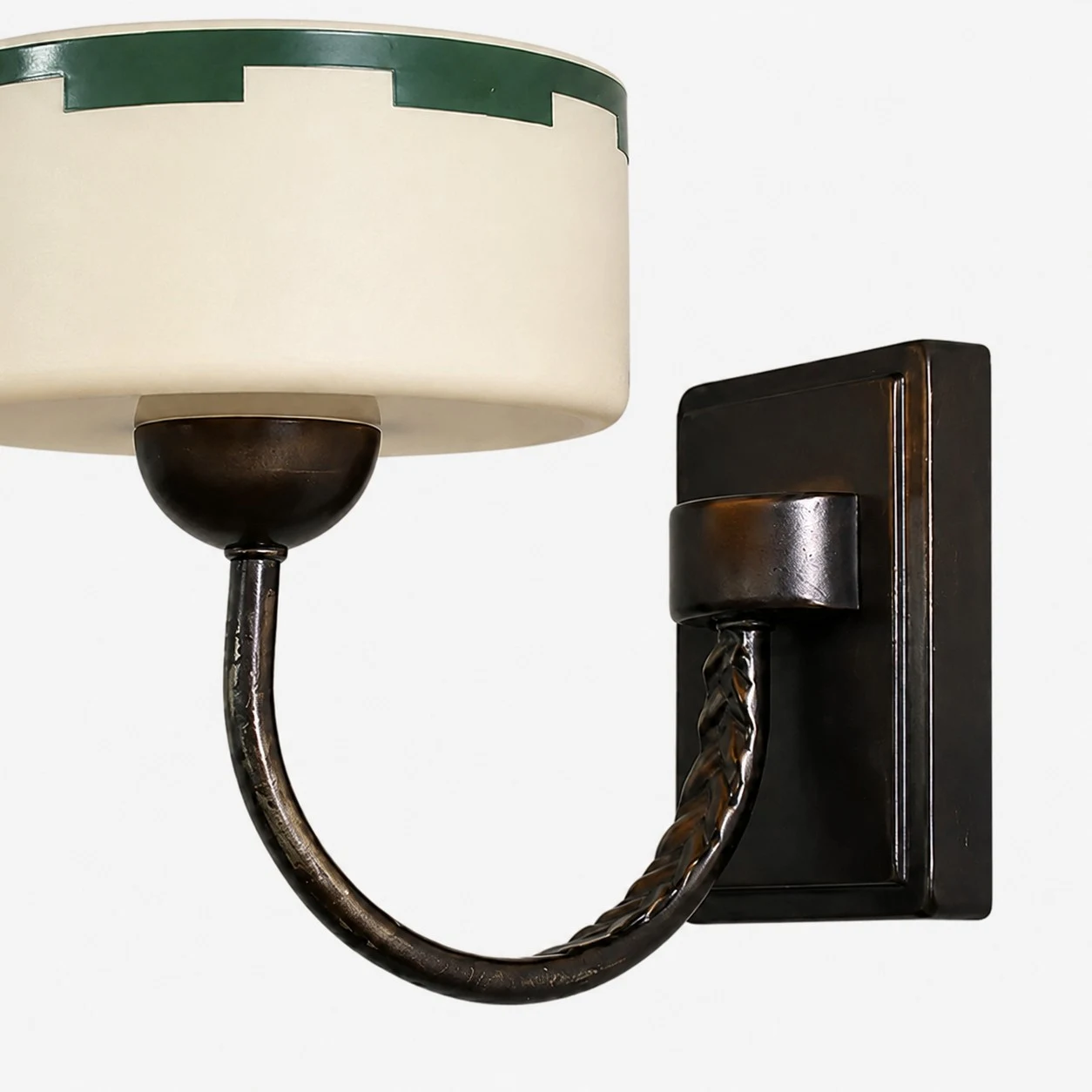 Glass shade, curved arm and hand-aged metal finish detail