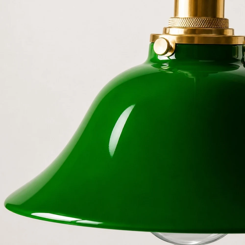 Green glass pendant lamp brass fitter and curved shade detail