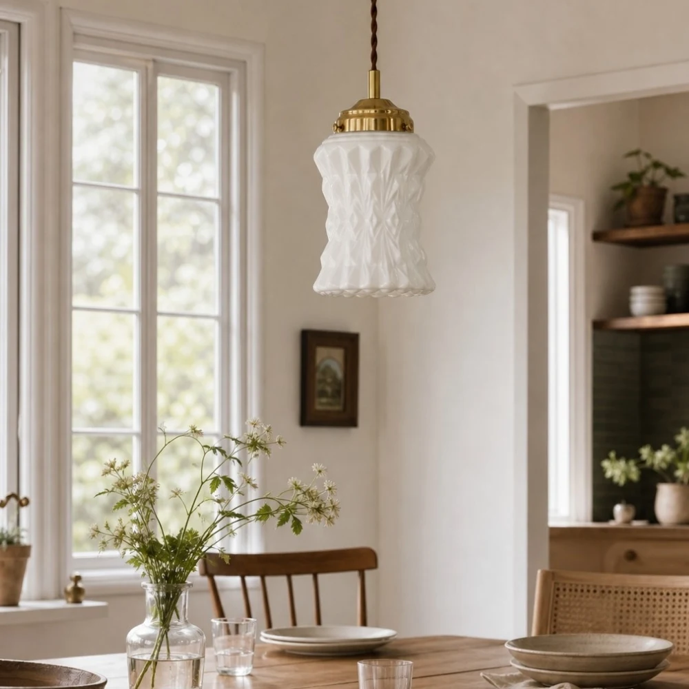 Milk glass pendant above dining table