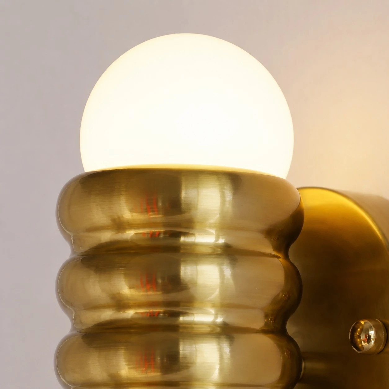 Warm illuminated brass shade detail