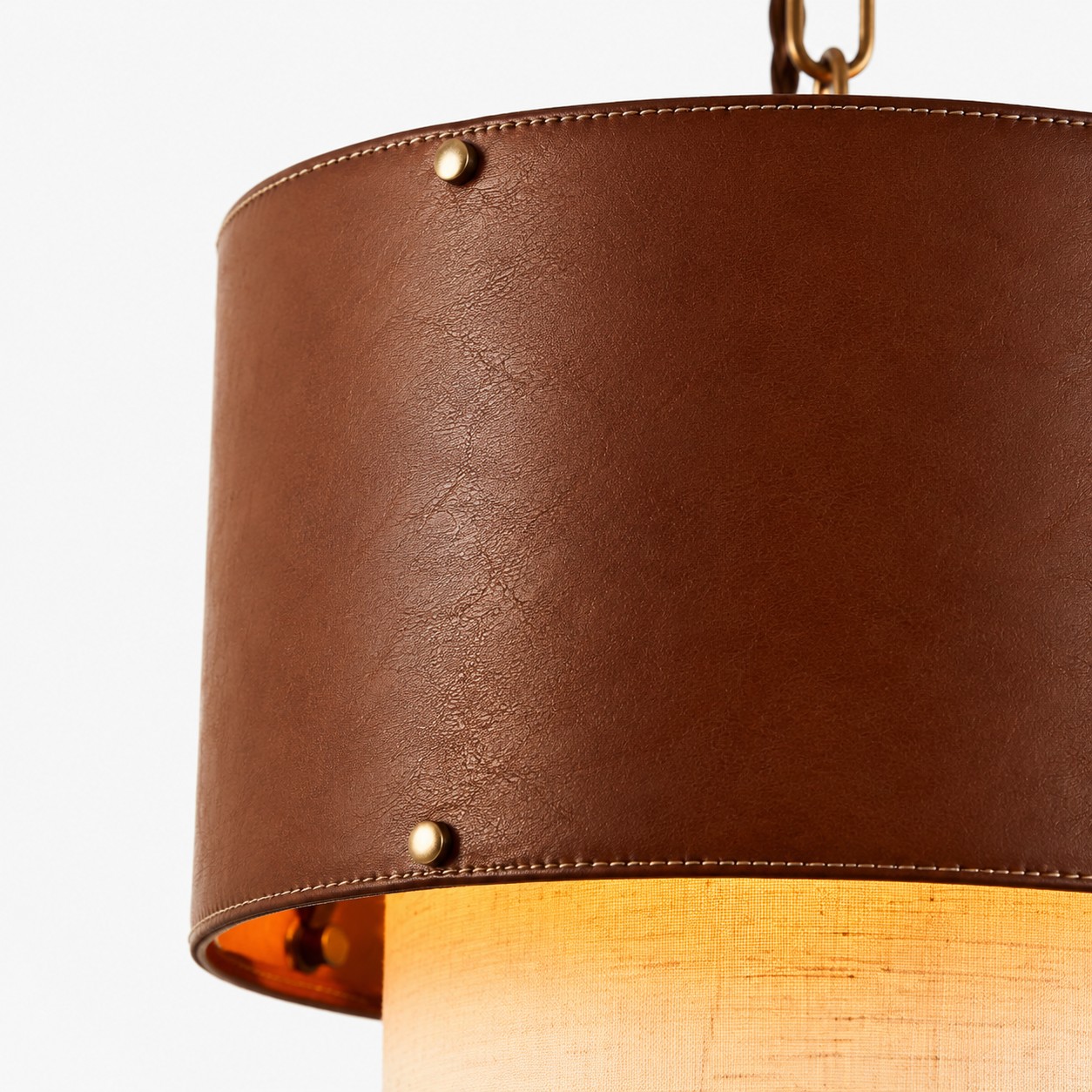 Brass and brown leather shade detail on pendant light
