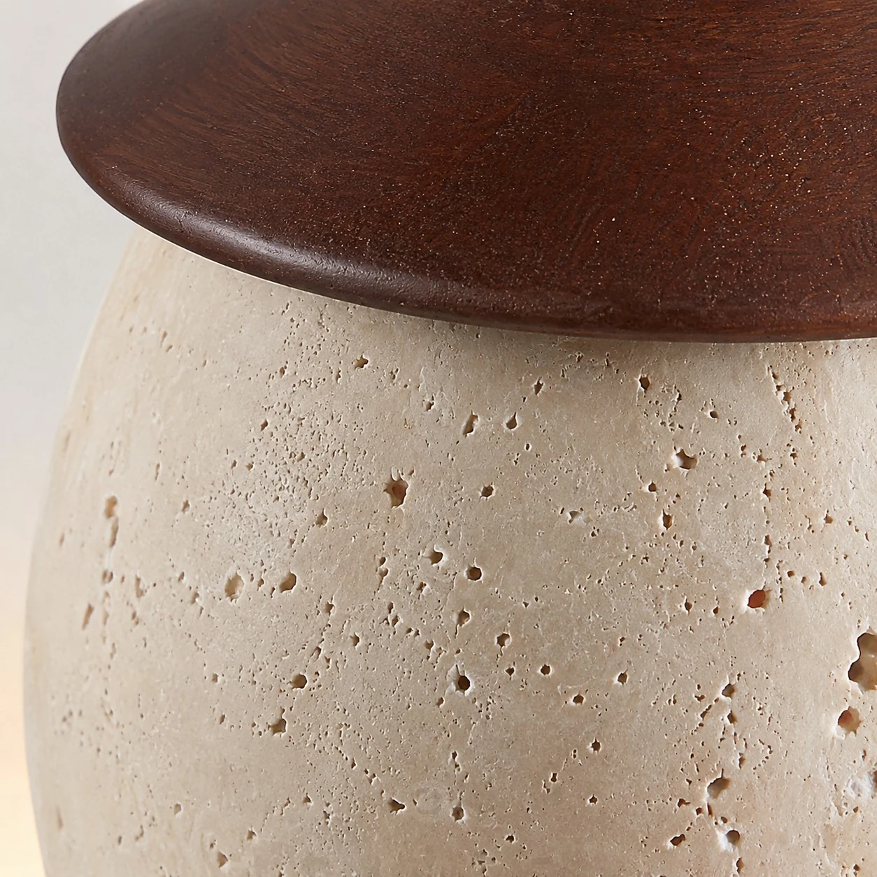 Stone texture and dark top fitting rim close-up