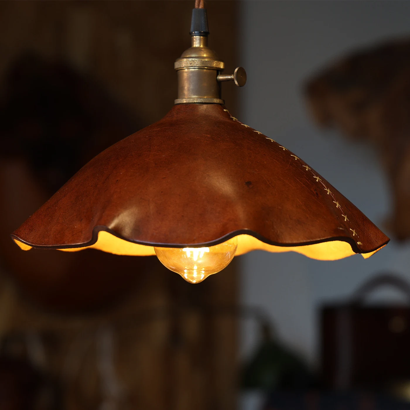 Leather shade shape and stitched edge detail