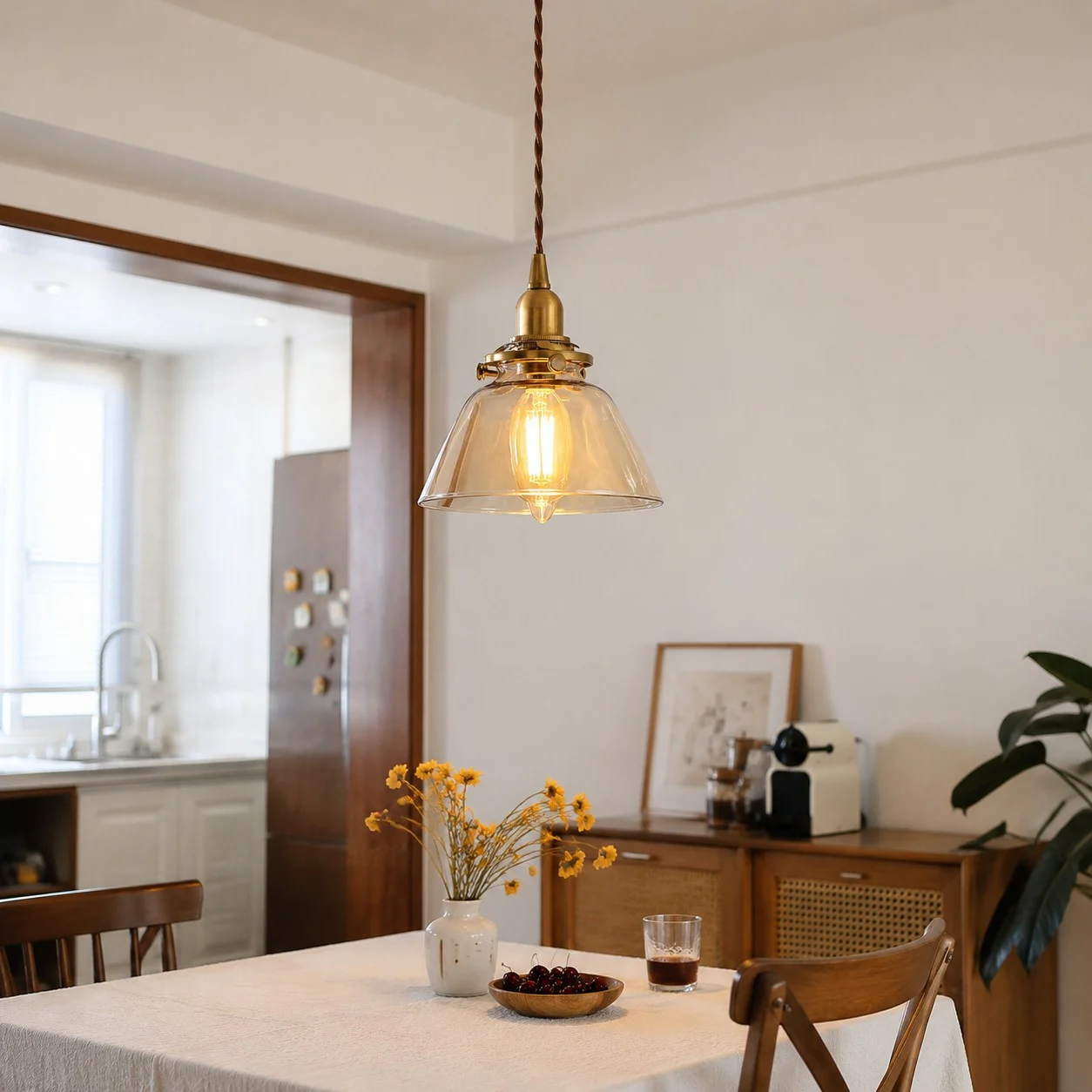 Amber glass pendant above a kitchen table