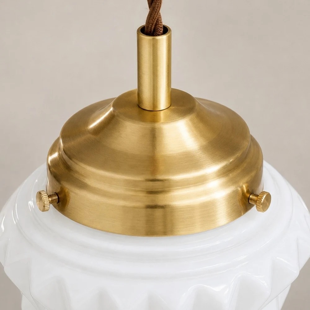Brass finish cap and milk glass shade detail
