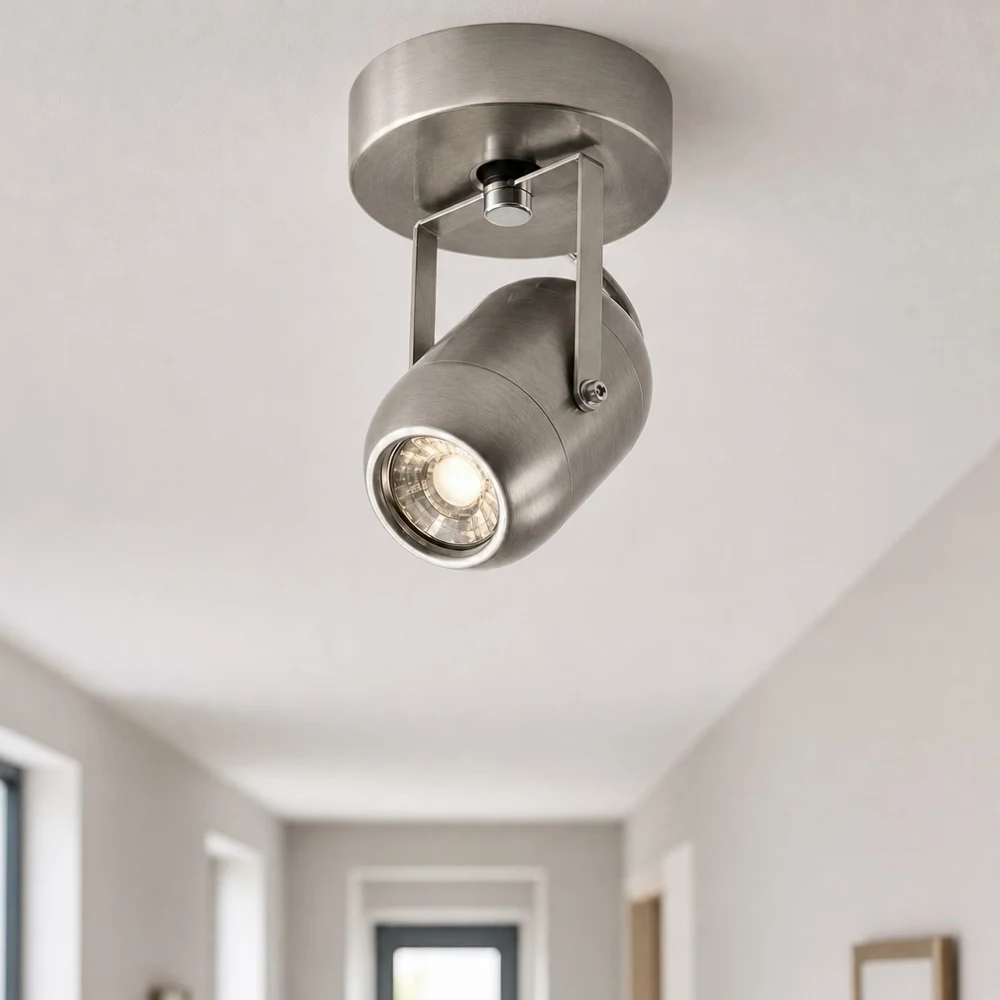 Adjustable wall lamp adding warm accent light near an entryway