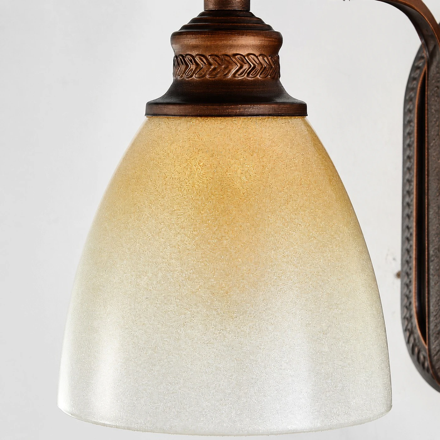 Antique bronze amber glass wall sconce