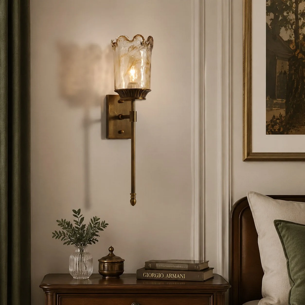 Brass amber glass wall sconce above a console table