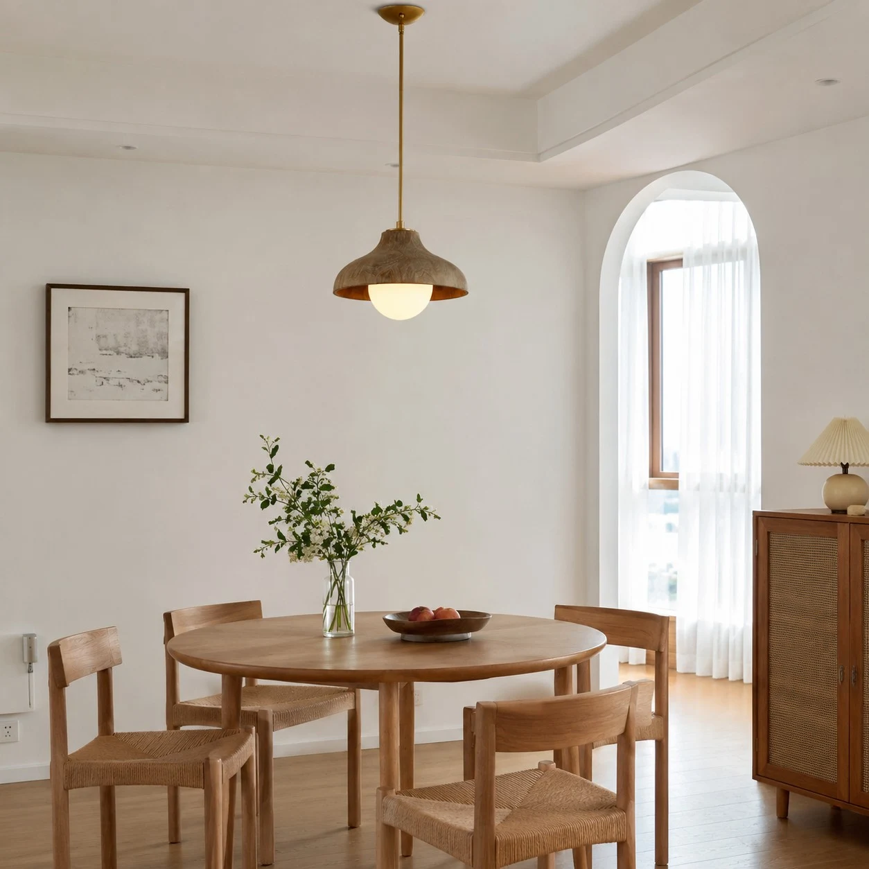 Pendant lamp above a round dining table