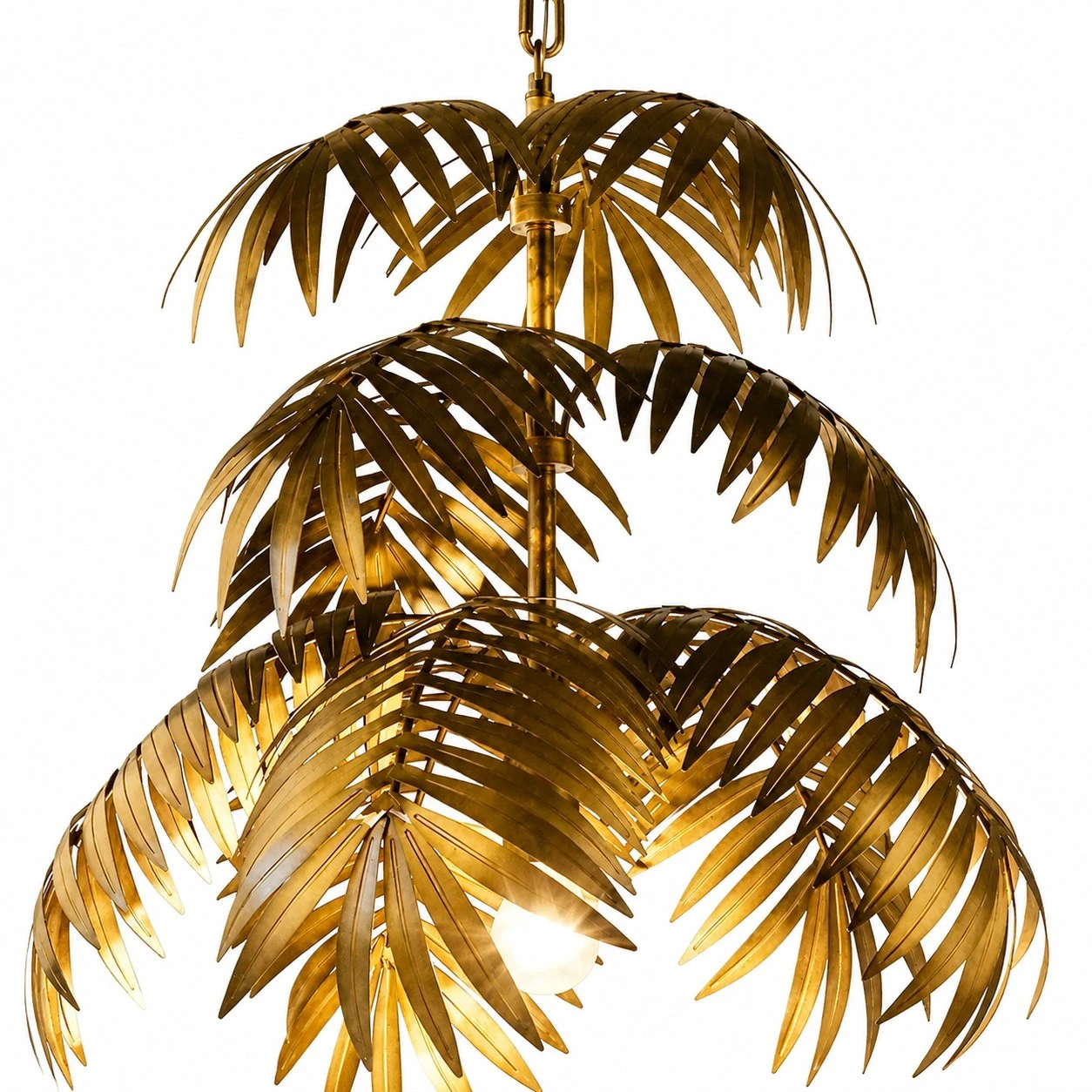 Three layer gold palm leaf chandelier on a white background
