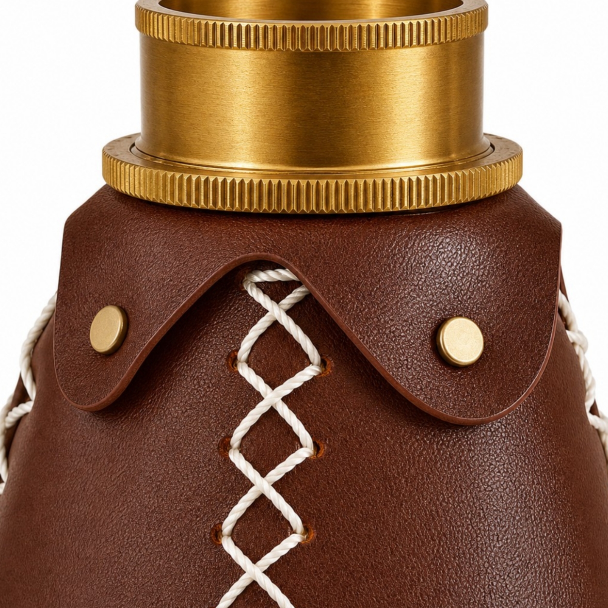 Close view of brass-tone hardware and leather lacing
